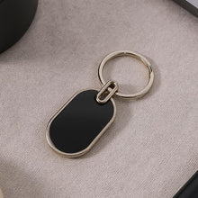 Elegant Black & Silver Oval Metal Keychain (1 Pc) - justgrabit.in | Just Grab It
