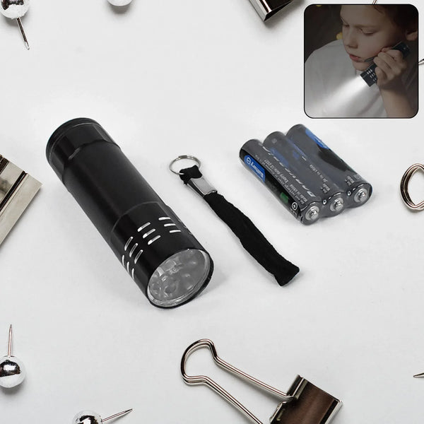 Portable Mini Torch - Super - Bright LED Flashlight with 3AAA Batteries Included - Justgrabit Inc.